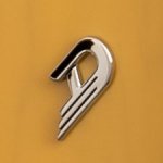 Duesenberg logo displayed against a butterscotch-colored background, highlighting its sleek silver design and dynamic contours.
