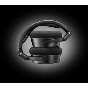 Folded view of the Neumann NDH 20 studio headphones, highlighting the compact, portable design with padded earcups and a sturdy metal headband.