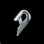 Duesenberg logo in sleek silver, displayed against a bold black background, emphasizing its elegant and timeless design.